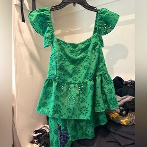 Green peplum style crop top with a tie back